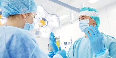 surgeons-in-operating-room-at-hospital-PBCVN6Z.jpg